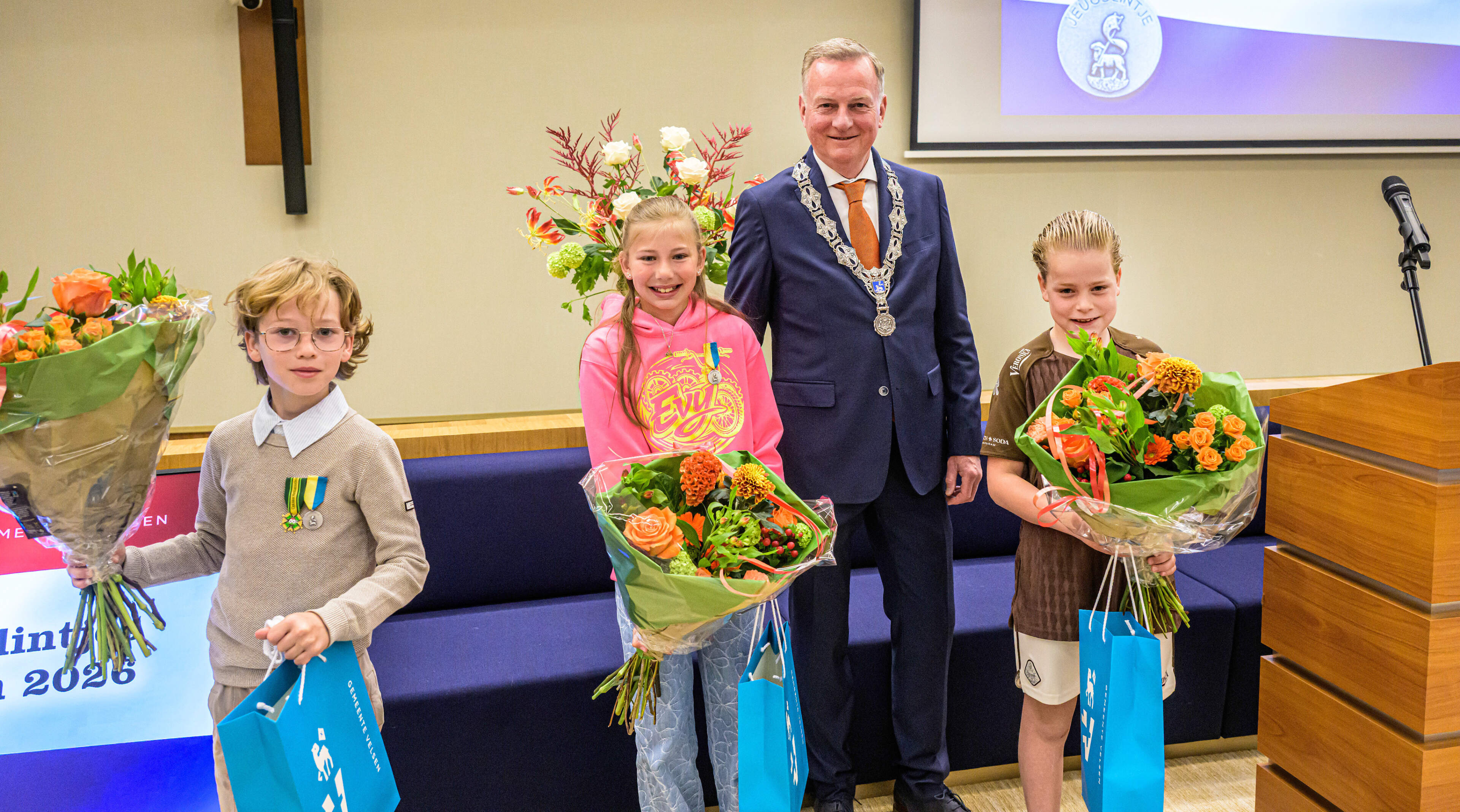 Evy (10), Sten (9) and Ryan (8) receive youth honors in Velsen, twelve residents receive regular honors